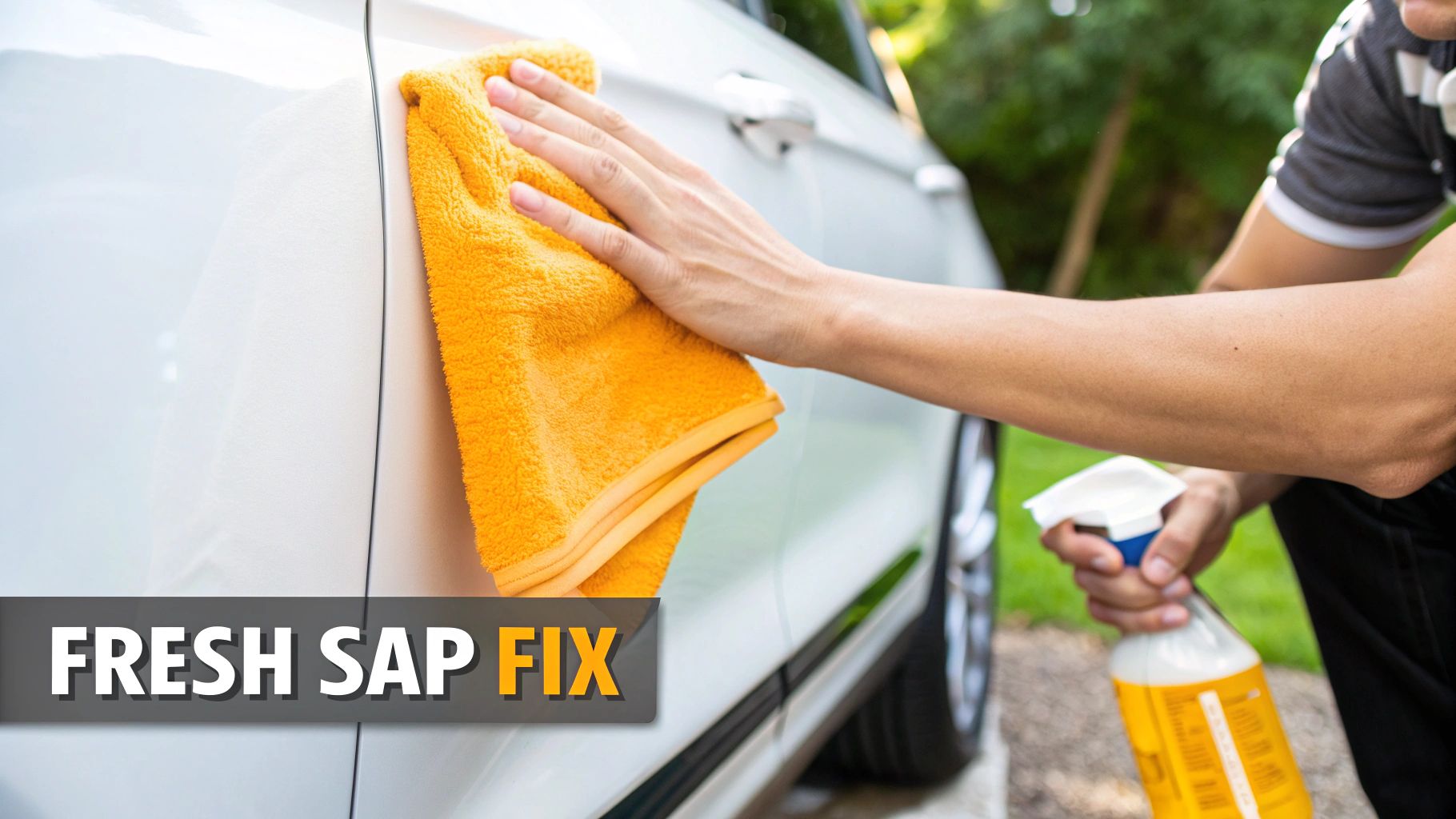 A person using a microfiber towel to gently wipe sap off a car's hood.