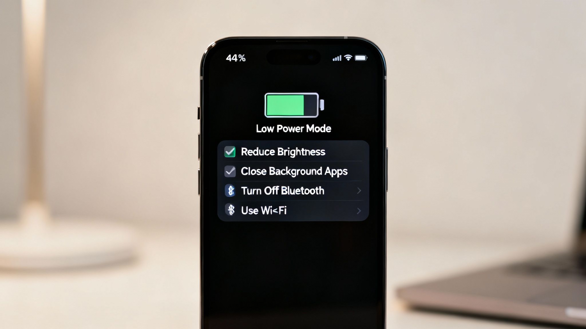 Close-up of an iPhone screen displaying Low Power Mode at 44% battery to conserve power.