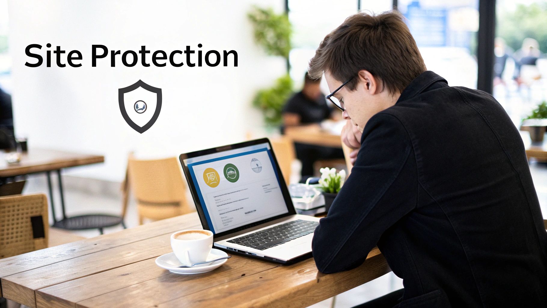 A man works on a laptop at a cafe, with a coffee cup nearby and 'Site Protection' text.