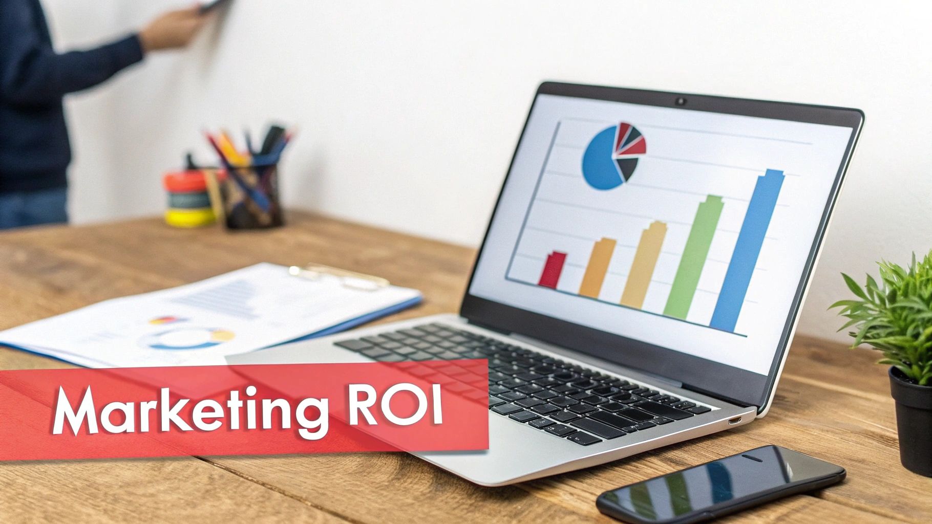 Laptop displaying a growth chart and pie chart, with 