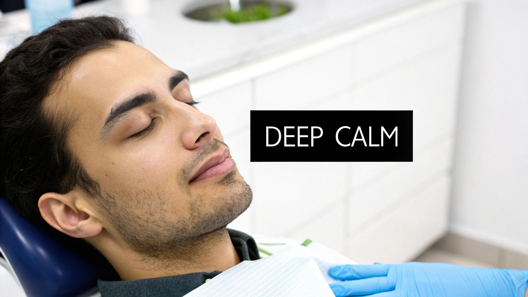 A man with closed eyes lies in a dental chair, a gloved hand on his chest, showing deep calm.