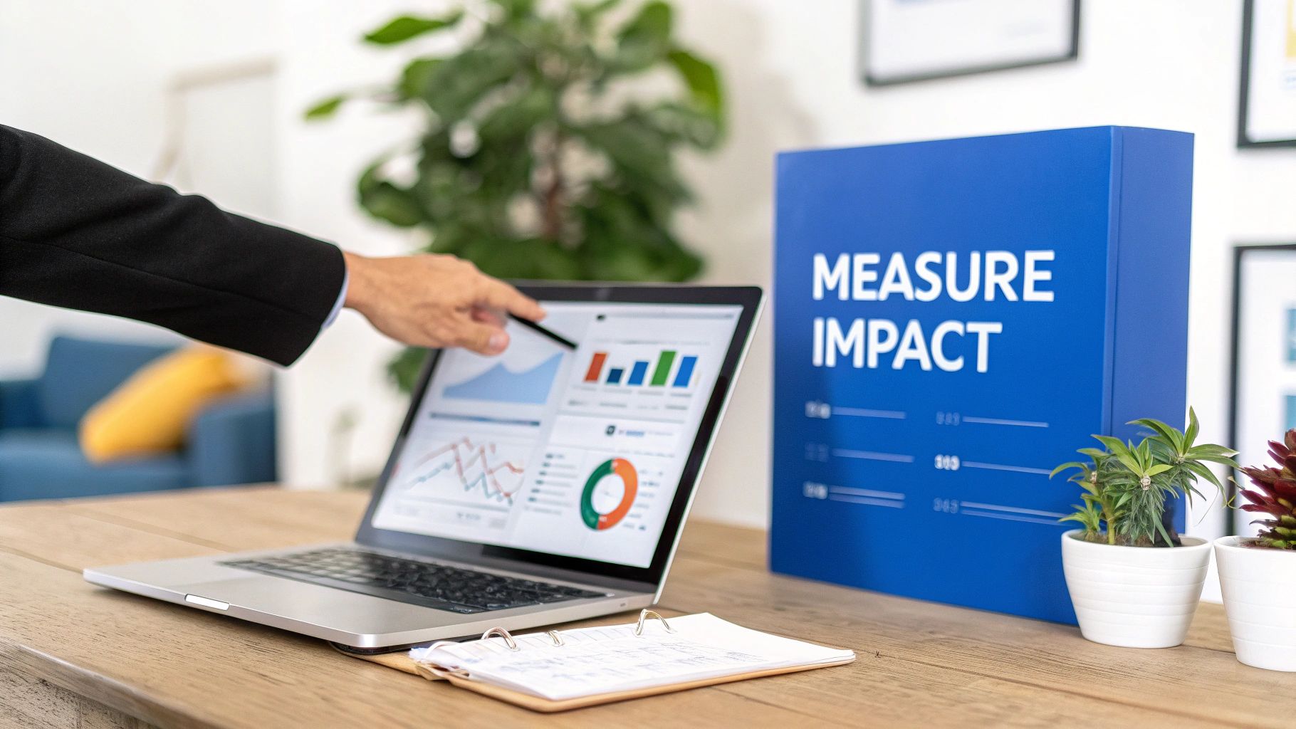 A professional points at a laptop displaying data charts, next to a 'Measure Impact' board.