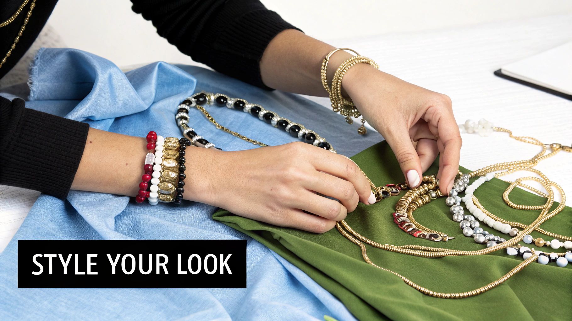 A woman wearing layered non-tarnish necklaces and bracelets.