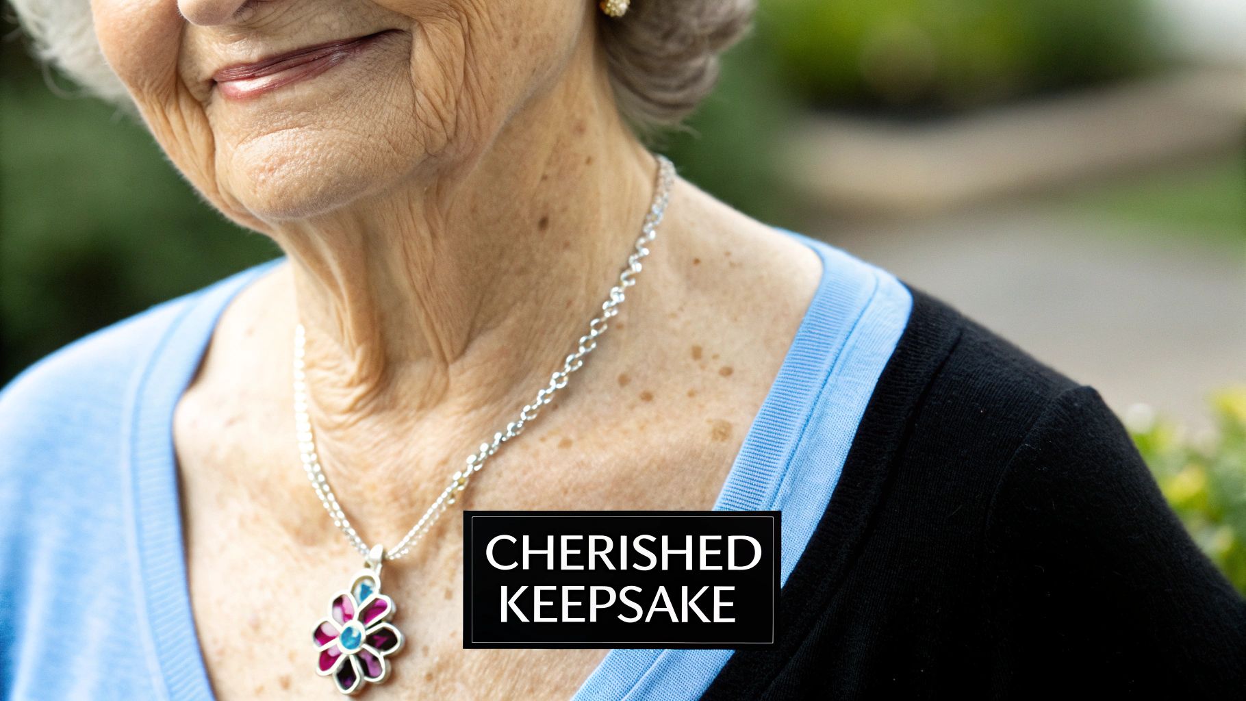 Grandmother wearing a birthstone necklace with her grandchild