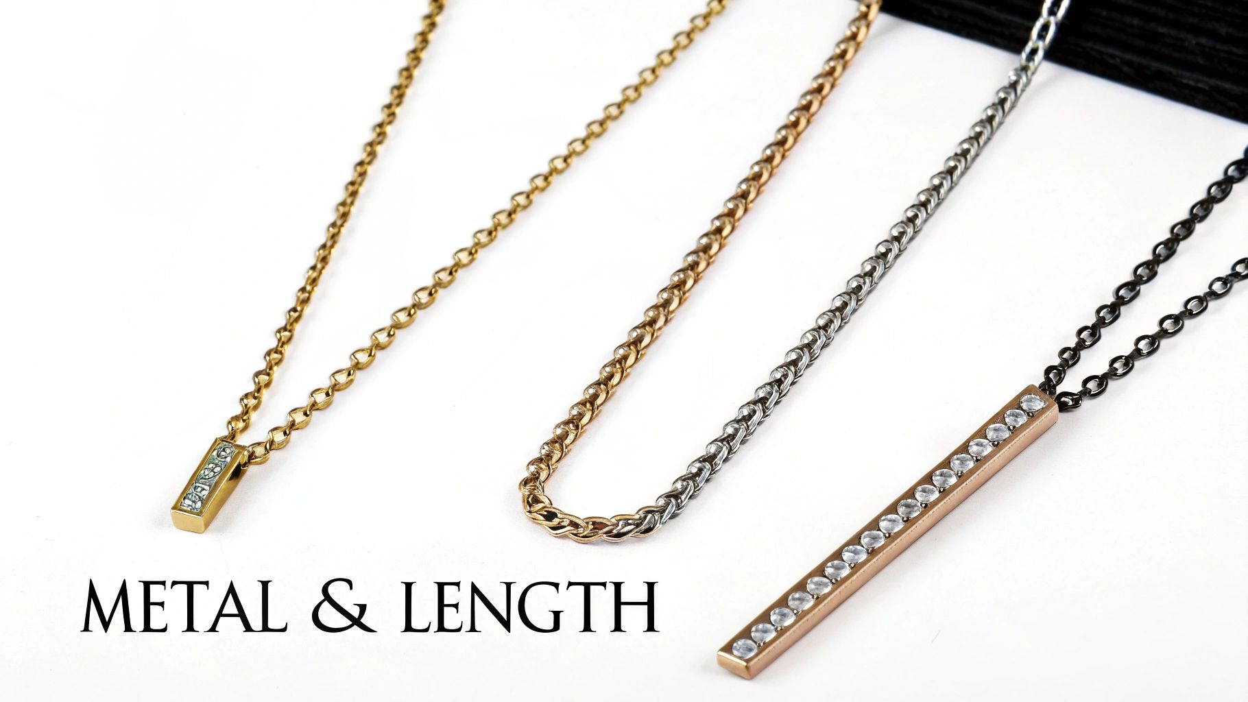 Three elegant necklaces showcasing different metal finishes and lengths on a white background.