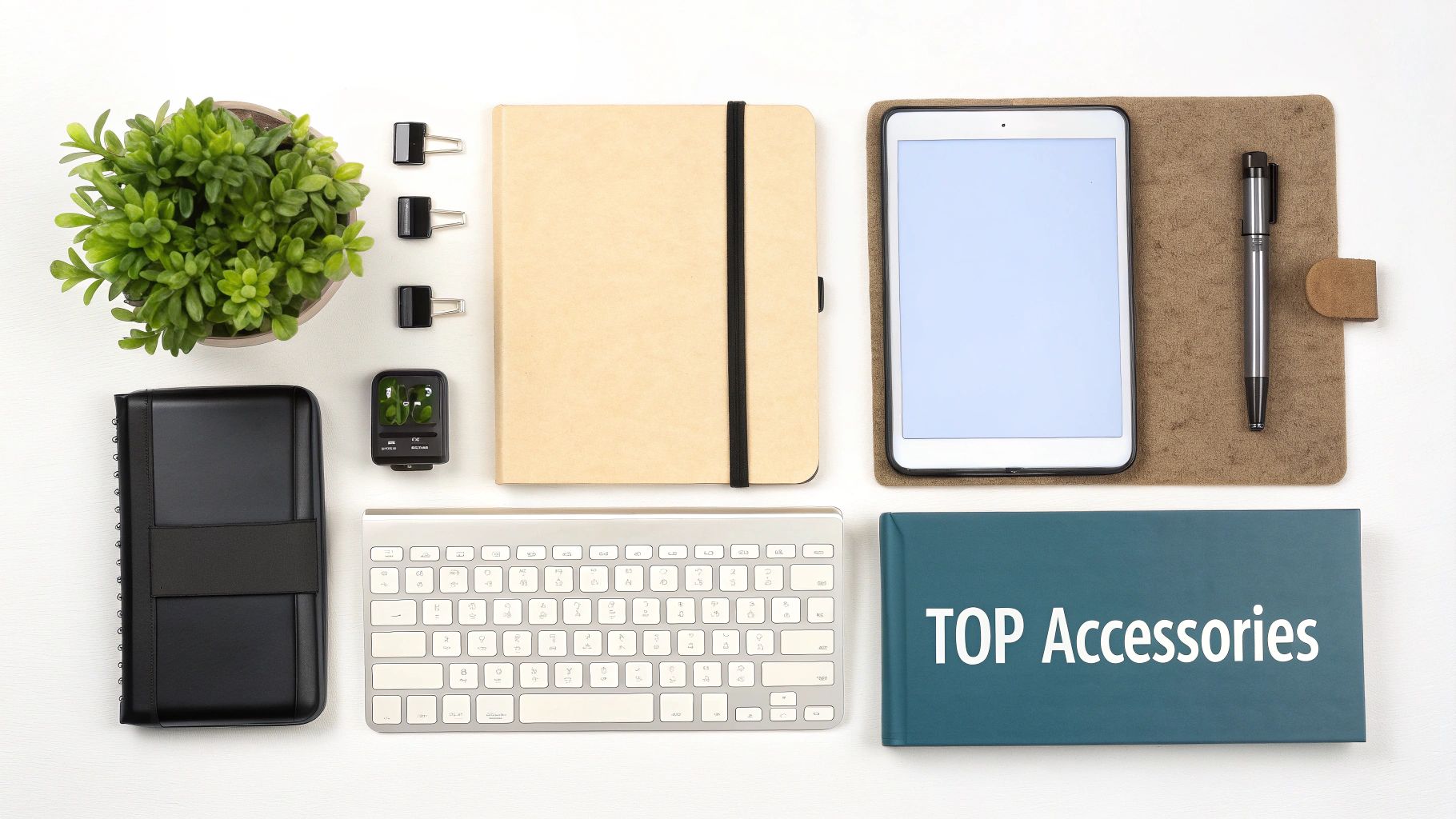 Top-down view of a neatly arranged desk with various office and tech accessories like a tablet, keyboard, and notebooks.