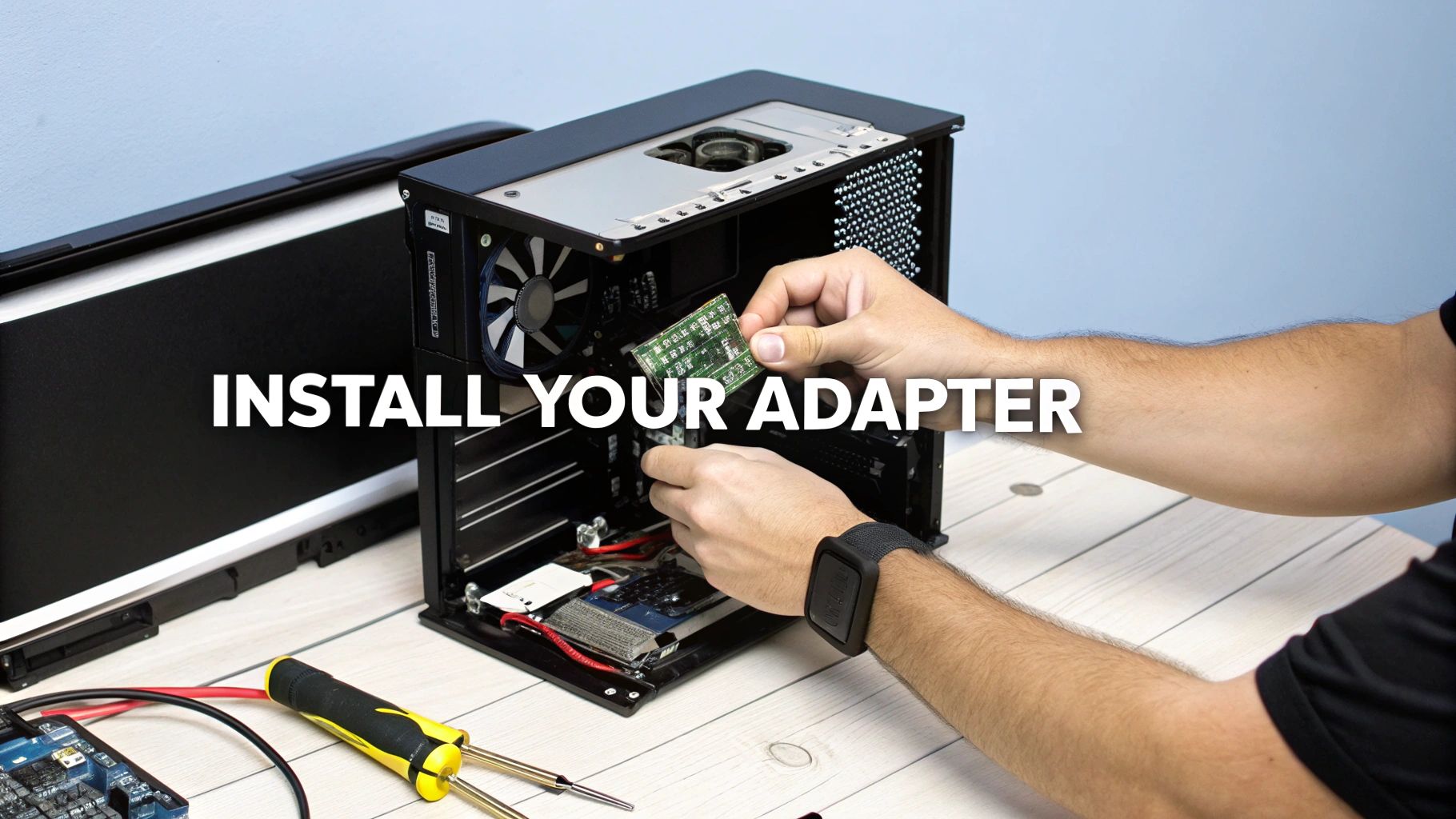 A person's hands installing a green circuit board adapter into a black desktop computer case.
