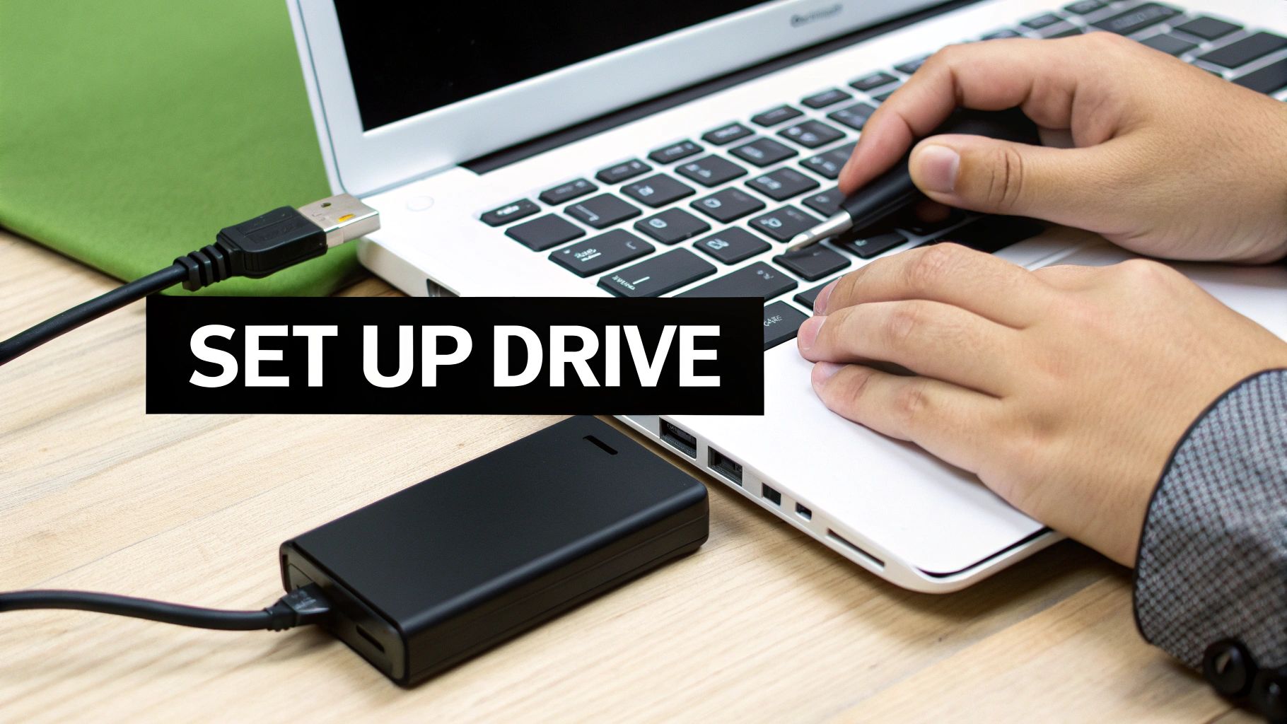 A person connects an external hard drive to a laptop via a USB cable. Text 'SET UP DRIVE'.