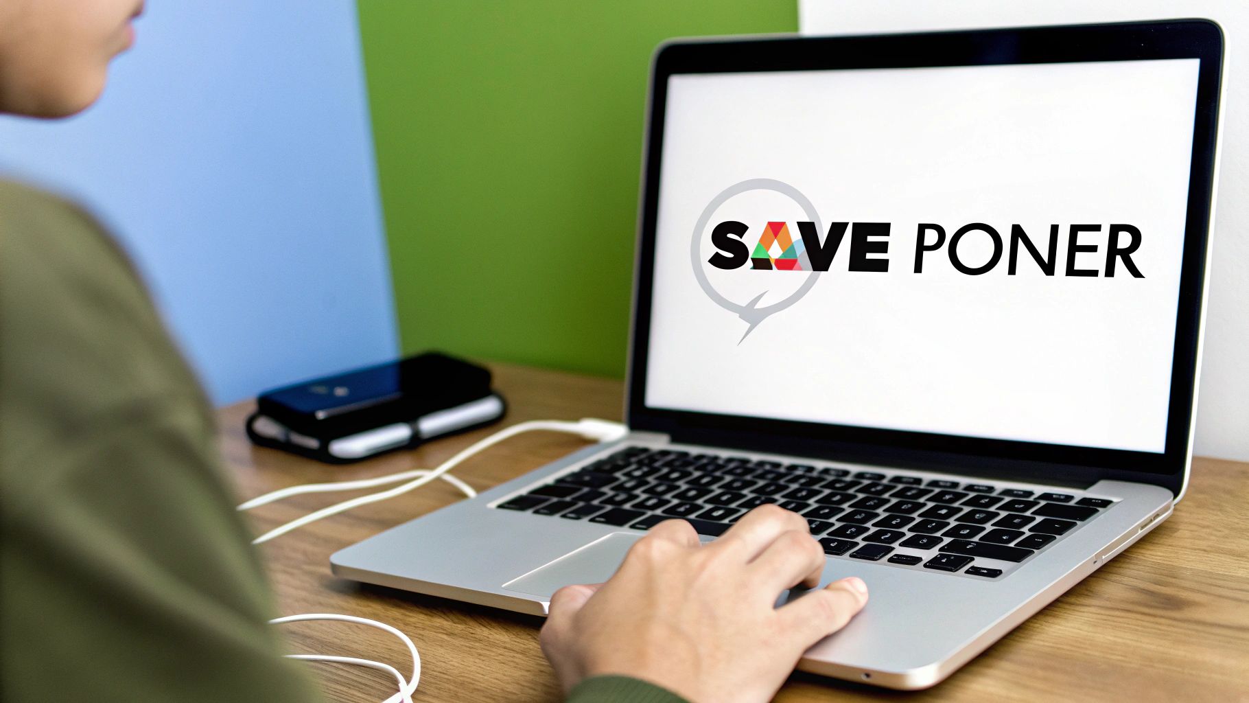 A person working on a laptop at a desk with various peripherals, illustrating a typical daily workflow.