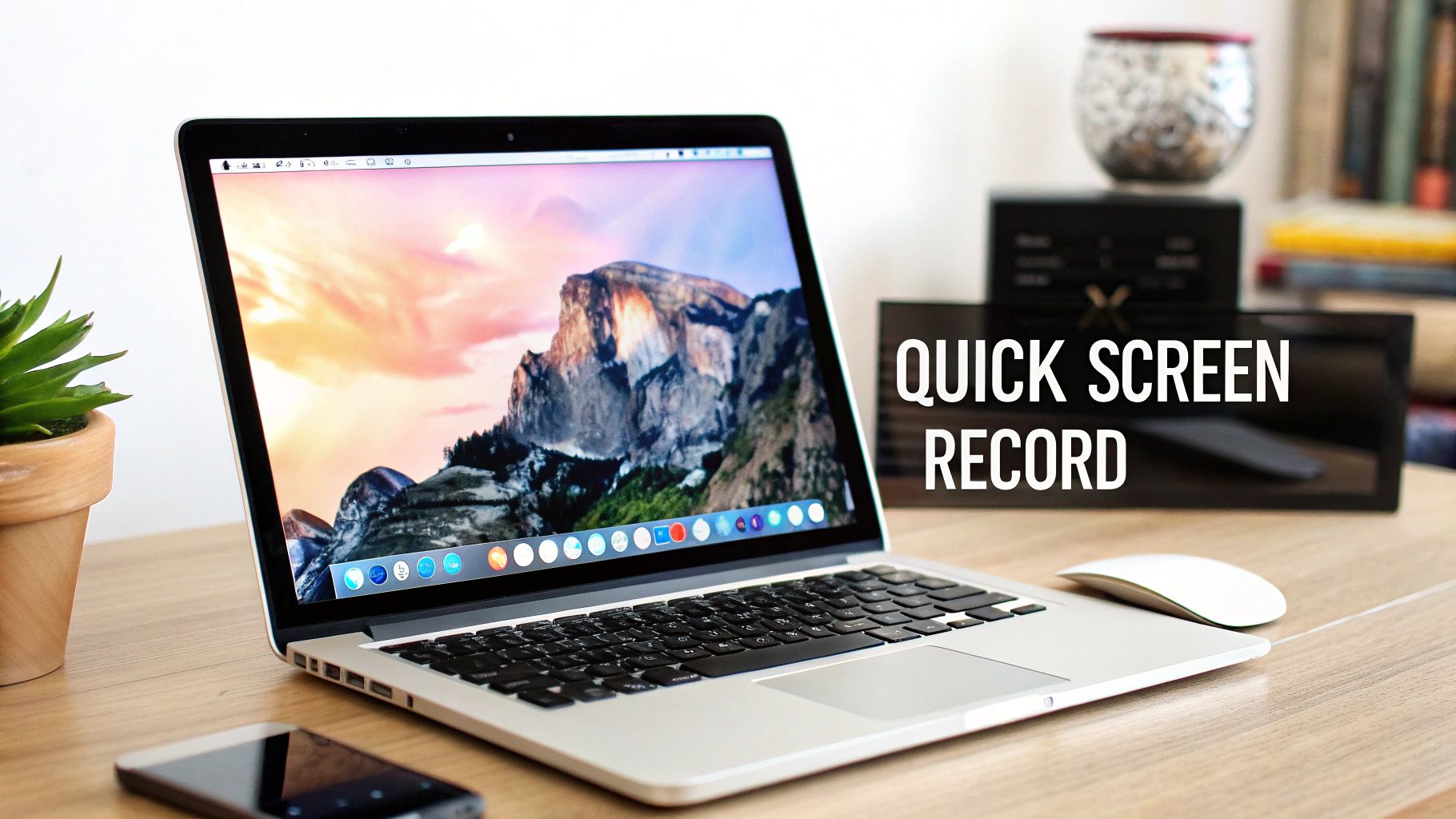 A MacBook Pro laptop on a wooden desk with a landscape wallpaper and text overlay Quick Screen Record.