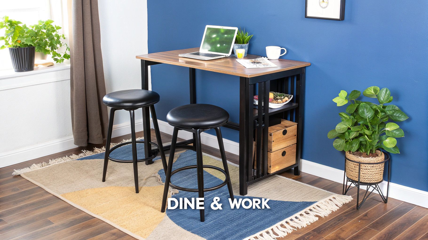 A compact dining and work table with two black bar stools against a blue wall, perfect for small apartments.
