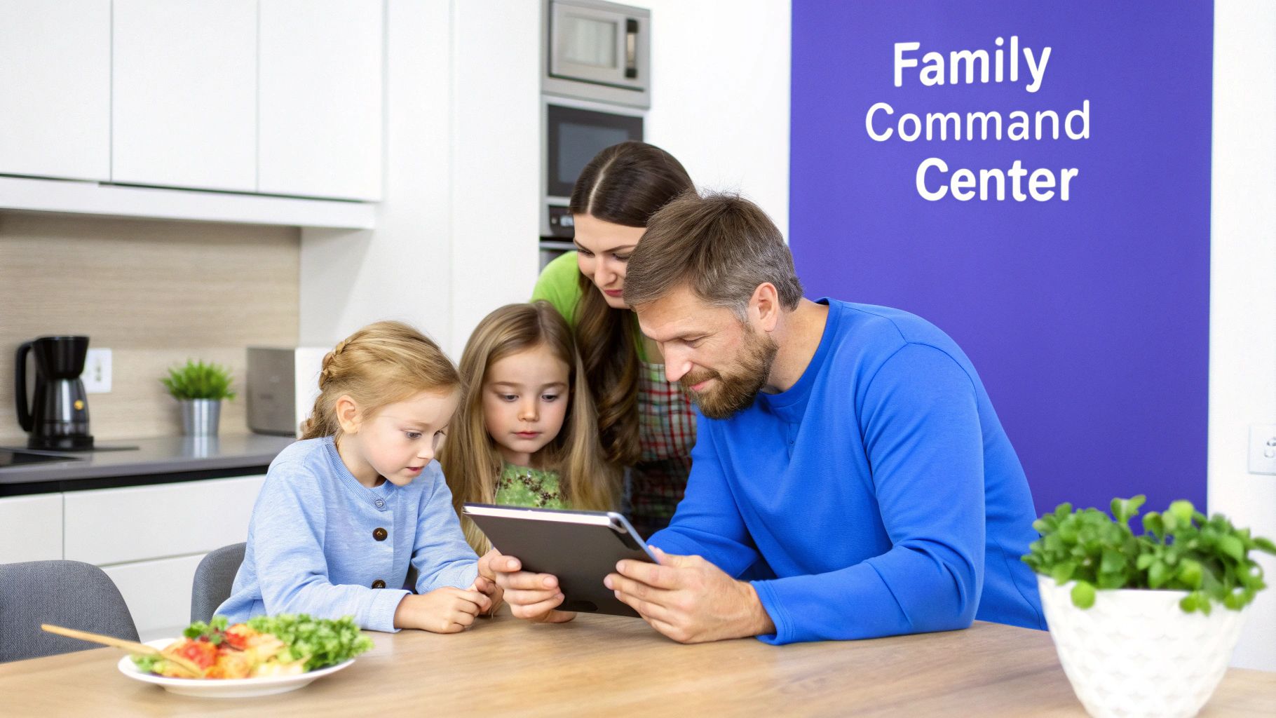 Family gathered around a tablet in their modern kitchen, with a 'Family Command Center' wall.