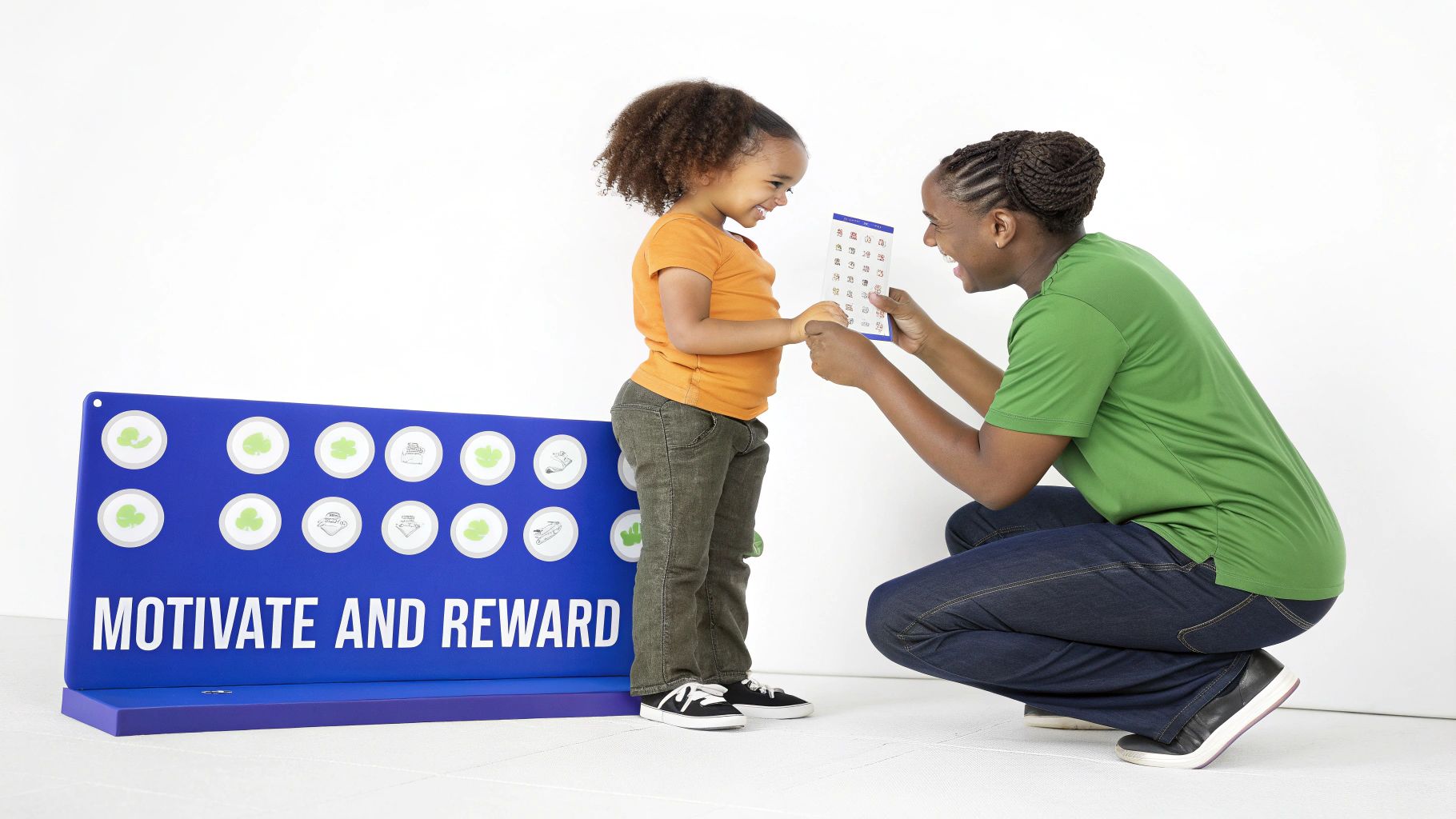 A smiling woman and child happily engage with a reward chart next to a "Motivate and Reward" board.