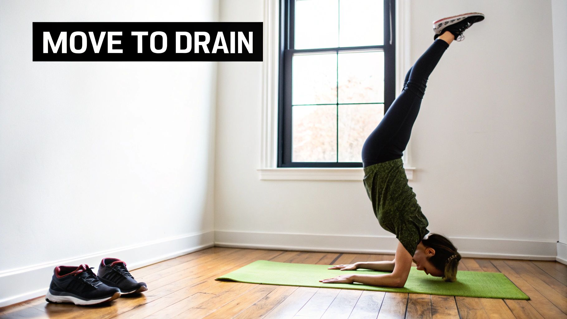 Woman in an inversion yoga pose on a green mat, promoting drainage for water retention.