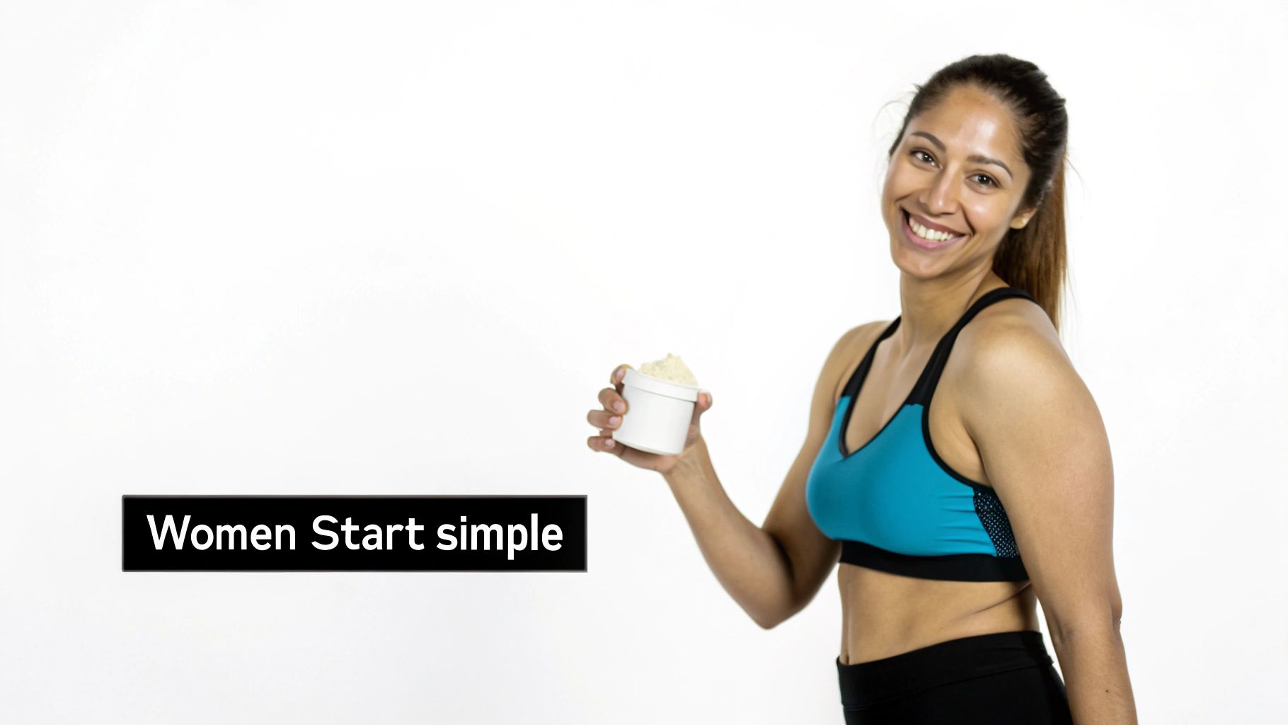 A smiling woman in athletic gear sitting on a yoga mat, looking strong and healthy.