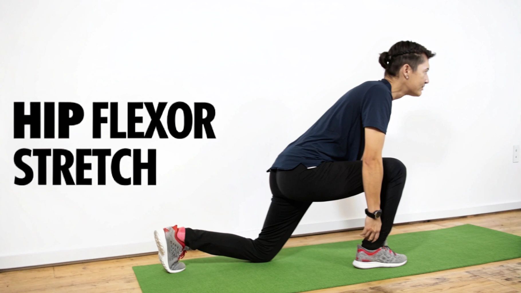 A woman performing a glute bridge exercise on a yoga mat to strengthen her pelvic foundation.