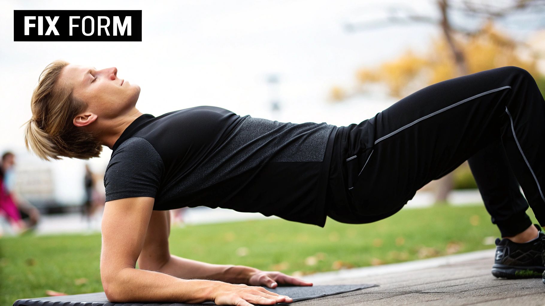 A personal trainer correcting a woman's form during a workout.