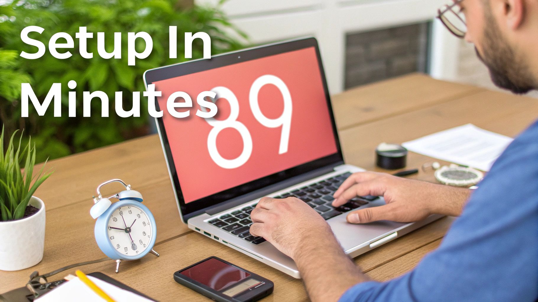 A man works on a laptop at a wooden desk with "Setup In Minutes" text and large numbers "89" on screen.