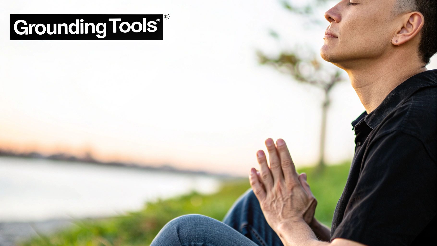A person with eyes closed, hands in prayer, meditating outdoors by water, with 'Grounding Tools' logo.