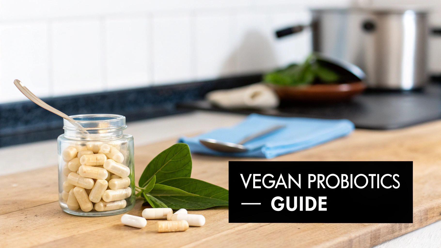 A jar of vegan probiotic capsules with a spoon and green leaves on a wooden kitchen counter.