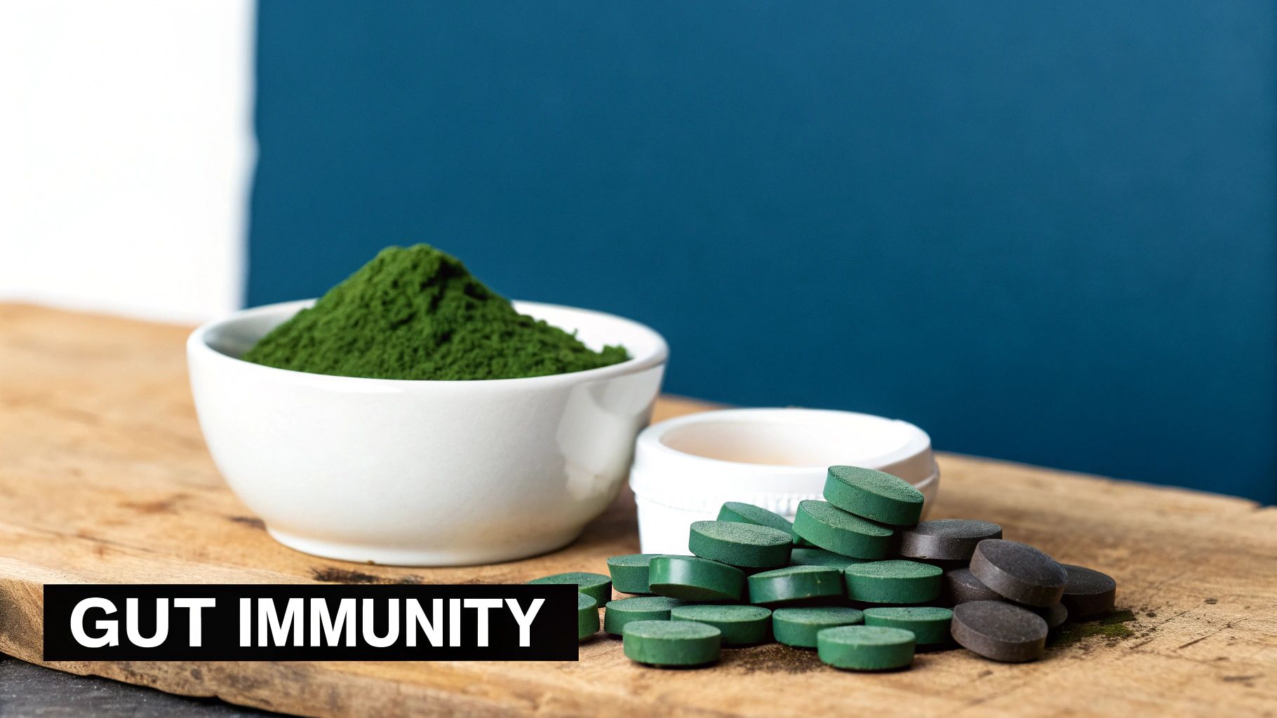 A bowl of green superfood powder and various green and dark grey immunity supplements.