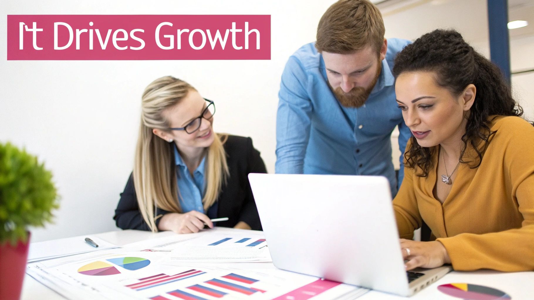 Business Team Collaborating On It Solutions With Laptop And Data Charts In Modern Office