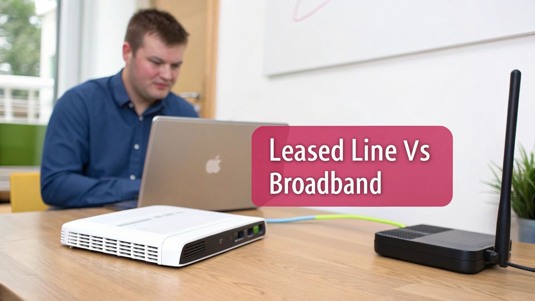 A Man Uses A Laptop, With Two Network Devices On A Desk And &Quot;Leased Line Vs Broadband&Quot; Text.