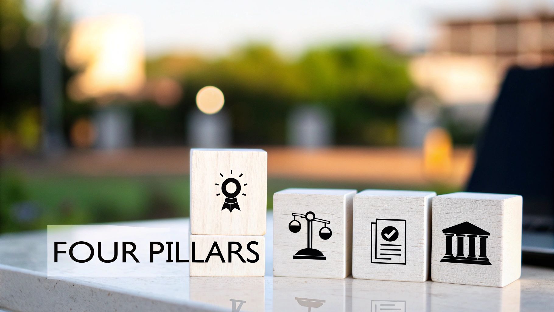 Four wooden blocks showing icons: award, justice, compliance, and institution, with 'FOUR PILLARS' text below.