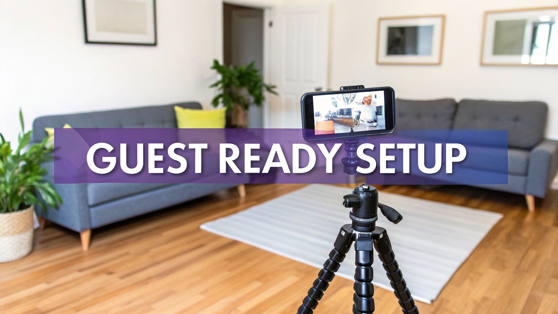 A smartphone on a tripod is set up in a clean living room, with a banner stating 'GUEST READY SETUP'.
