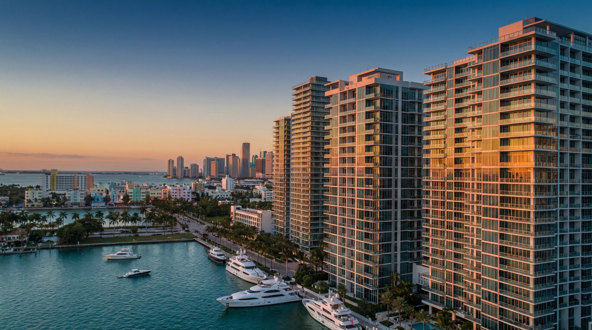 Miami waterfront luxury condos with Art Deco architecture showing premium short-term rental investment market