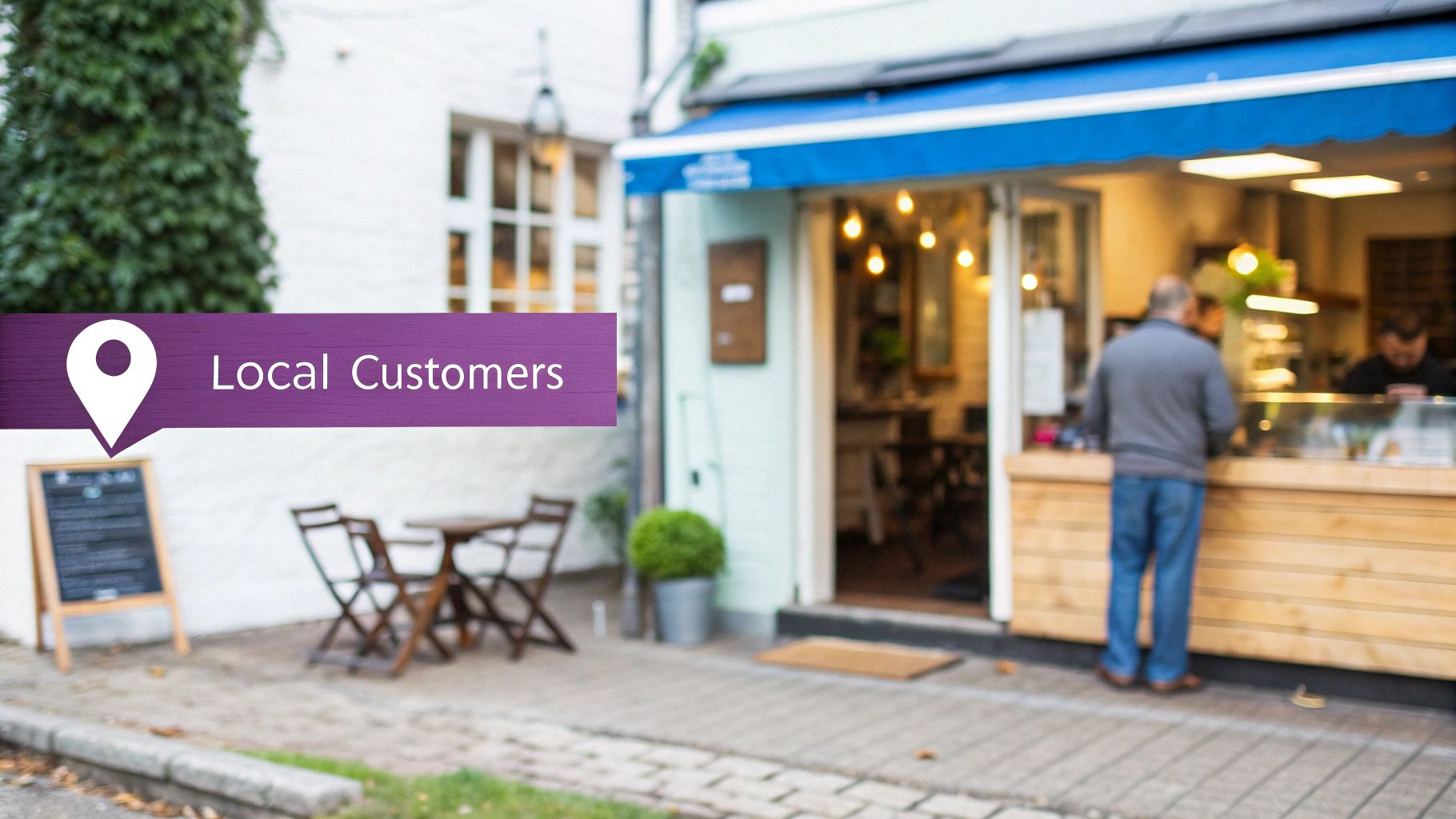 A small business with a blue awning and outdoor seating, with a banner stating 'Local Customers'.