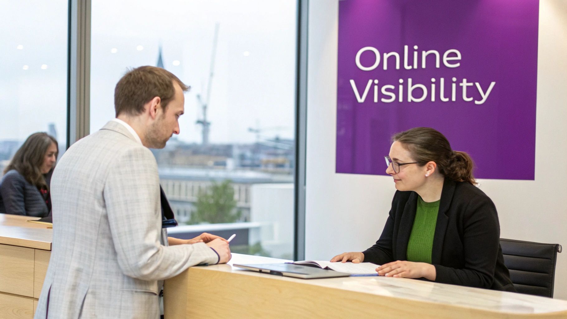 Two professionals discussing documents at a modern office counter with 'Online Visibility' sign.