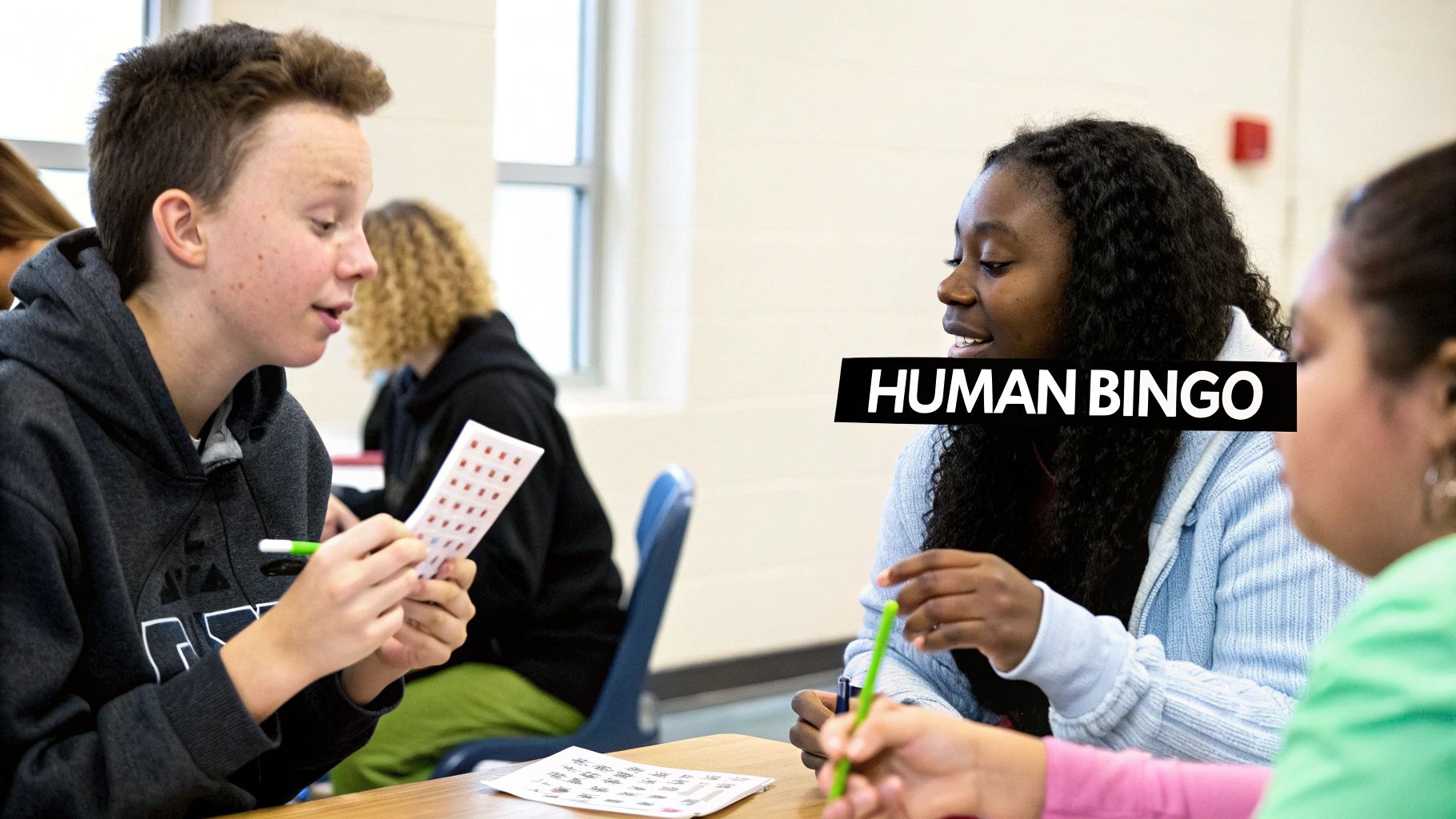 Youth group members playing Human Bingo, interacting and marking cards in a classroom.