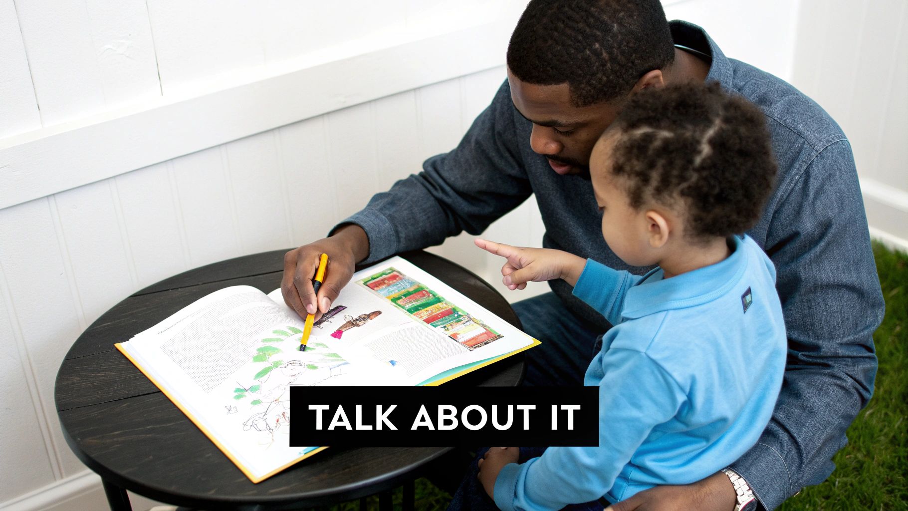 A father and young child read an illustrated book together, with the child pointing at the pages.