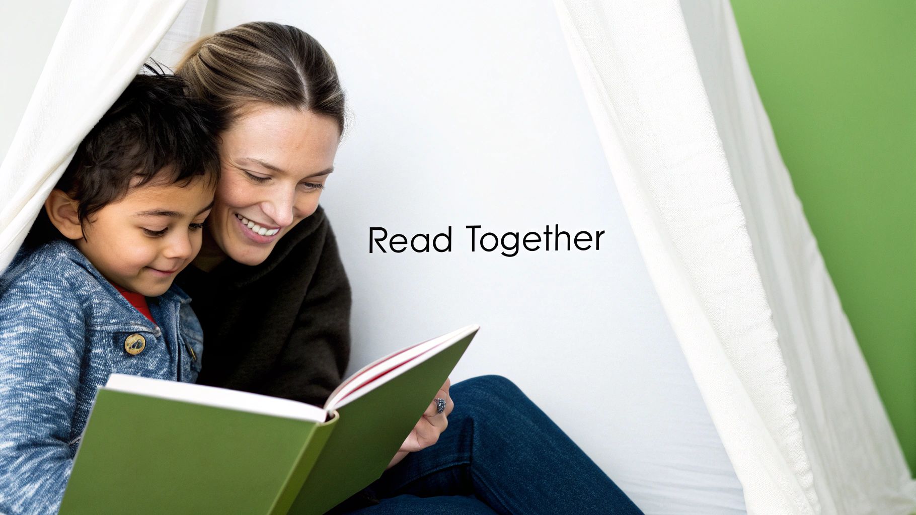 A smiling woman and child enjoy reading a book together under a cozy white tent.