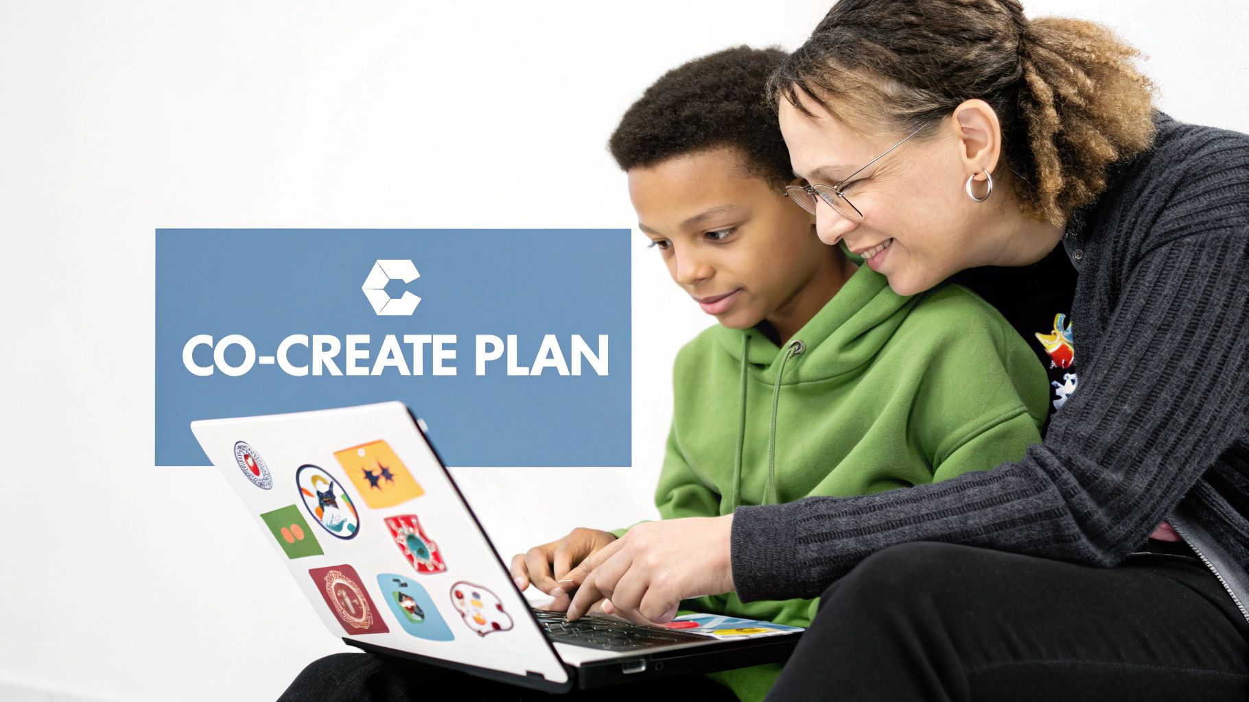 A smiling woman and a young boy collaborate on a laptop, working together on a co-create plan.