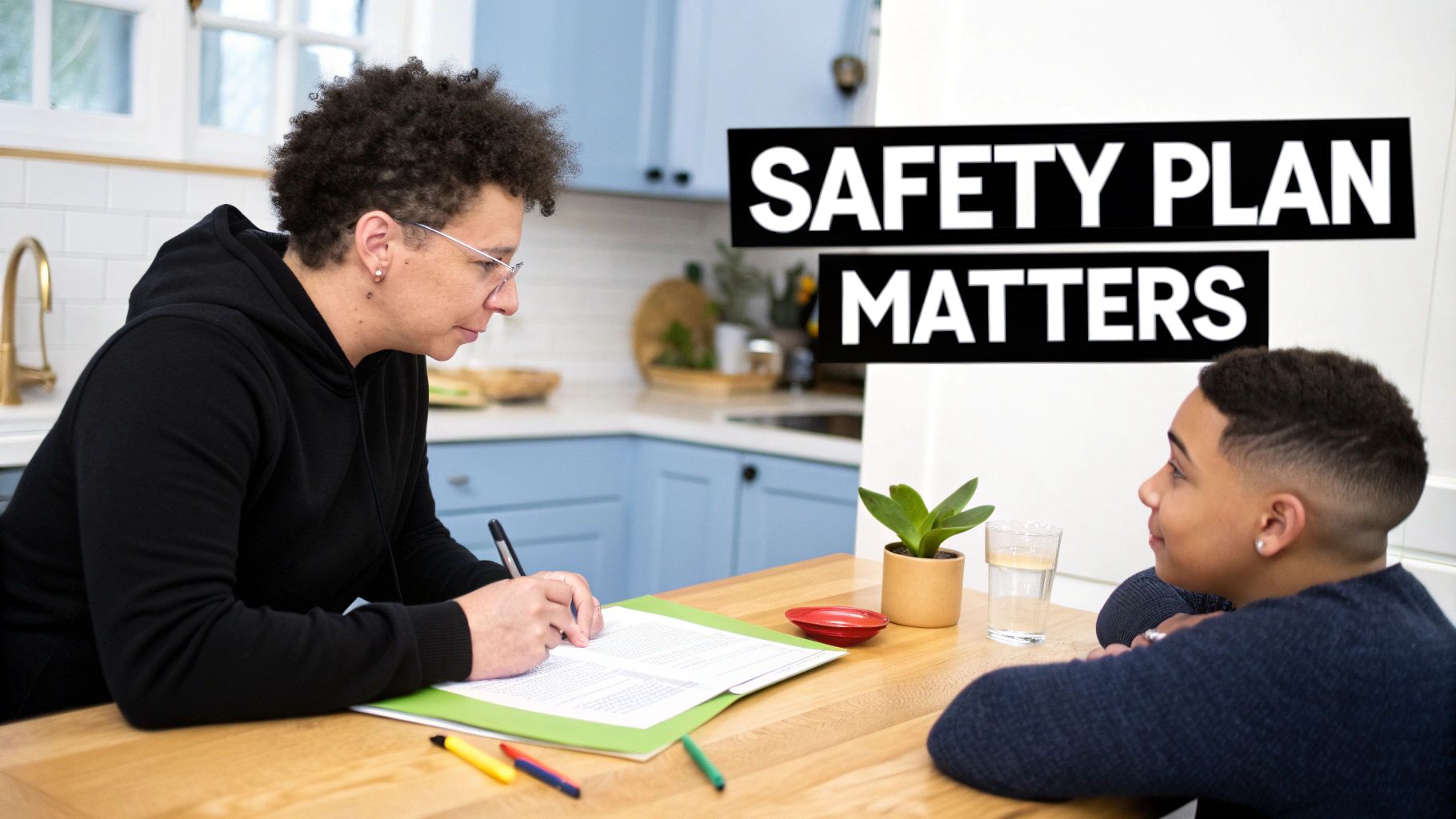 An adult and child sit at a kitchen table, discussing and writing a safety plan document.
