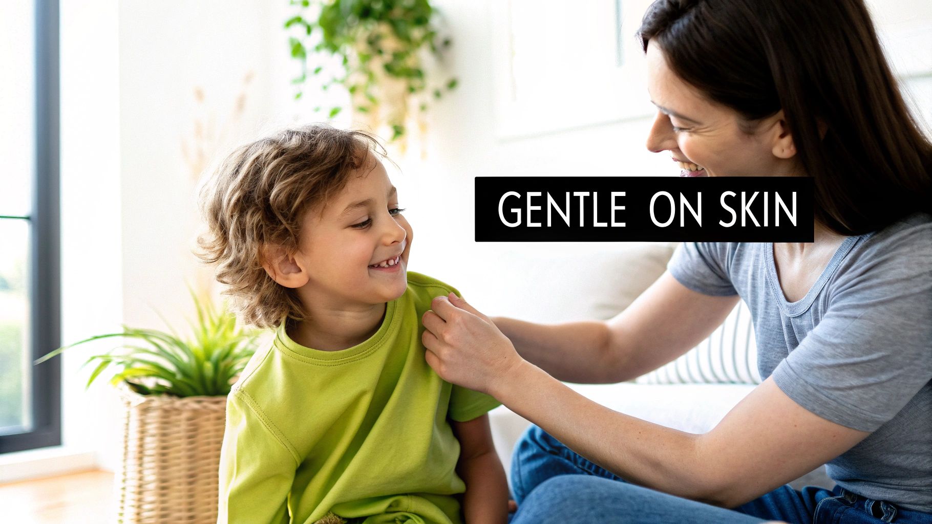 A happy mother gently adjusts her child's lime green organic cotton t-shirt, emphasizing gentleness on skin.