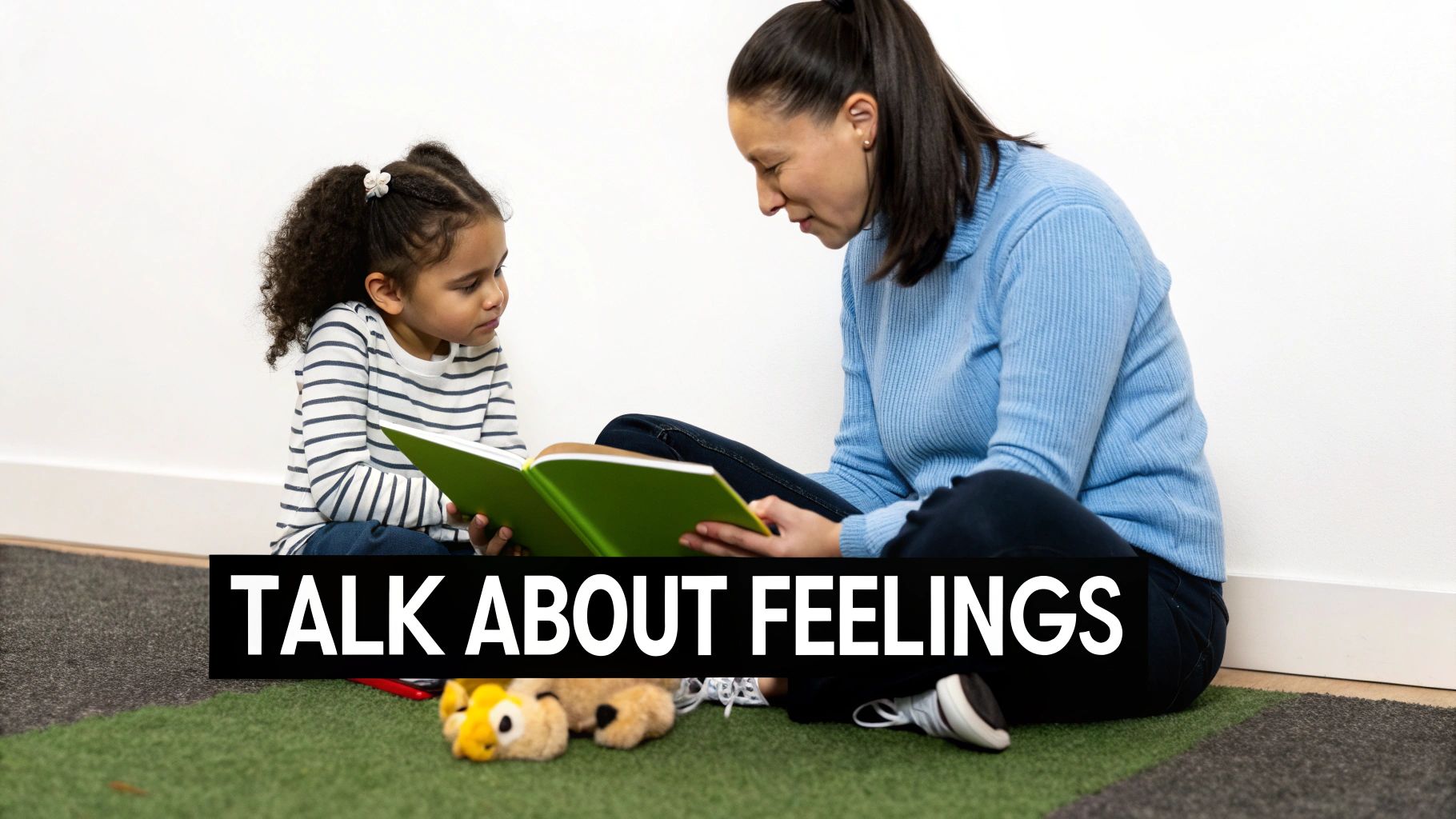 A woman and a young girl sit on a carpet reading a green book together, with text overlay 'TALK ABOUT FEELINGS'.