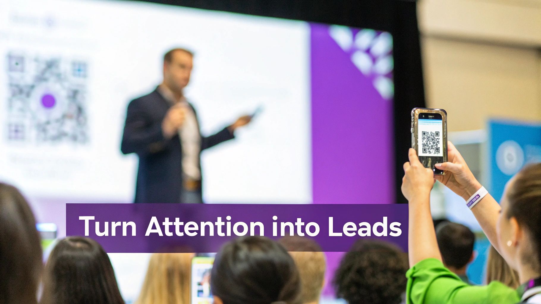 Audience member scanning a QR code on a large screen during a presentation to generate leads.