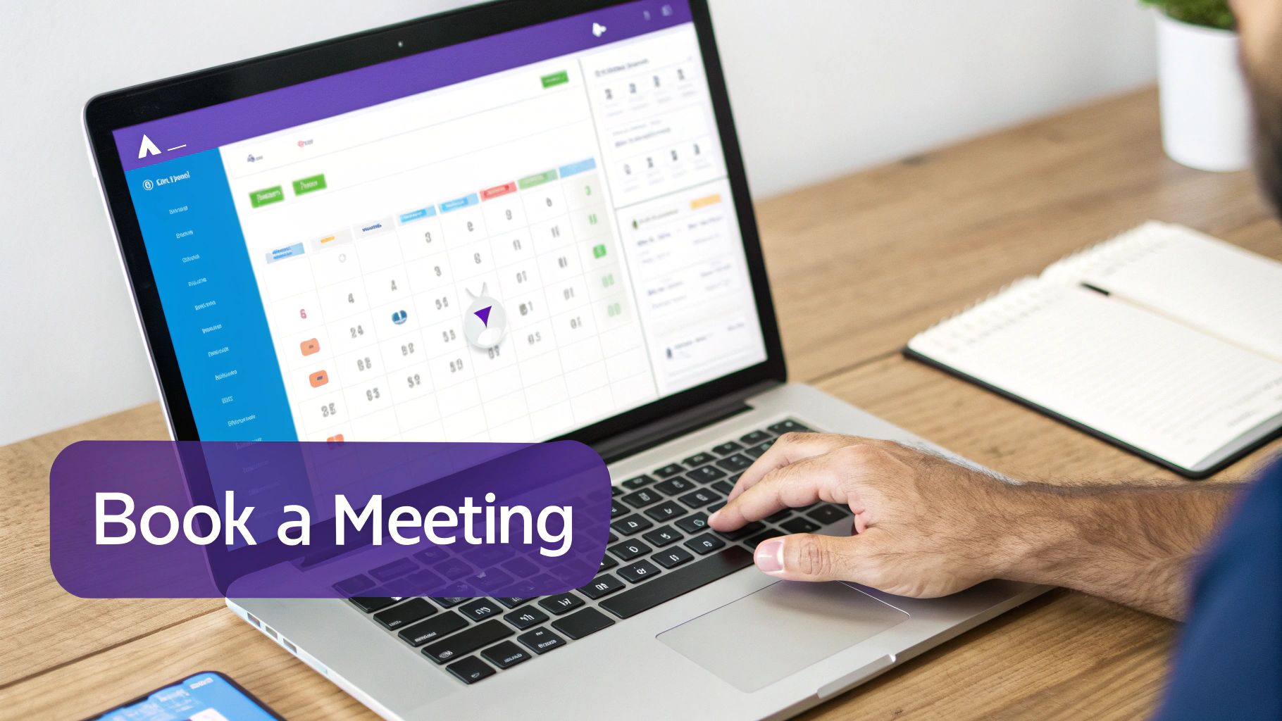 A person's hands typing on a laptop displaying an online calendar and scheduling application.