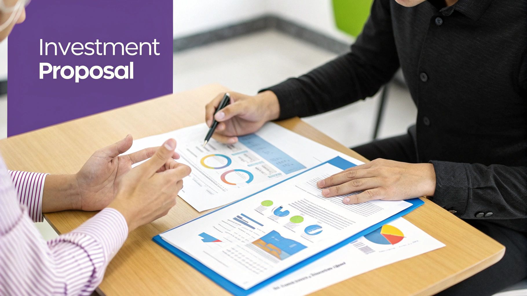 Two people discussing an investment proposal with financial charts and graphs on a table.