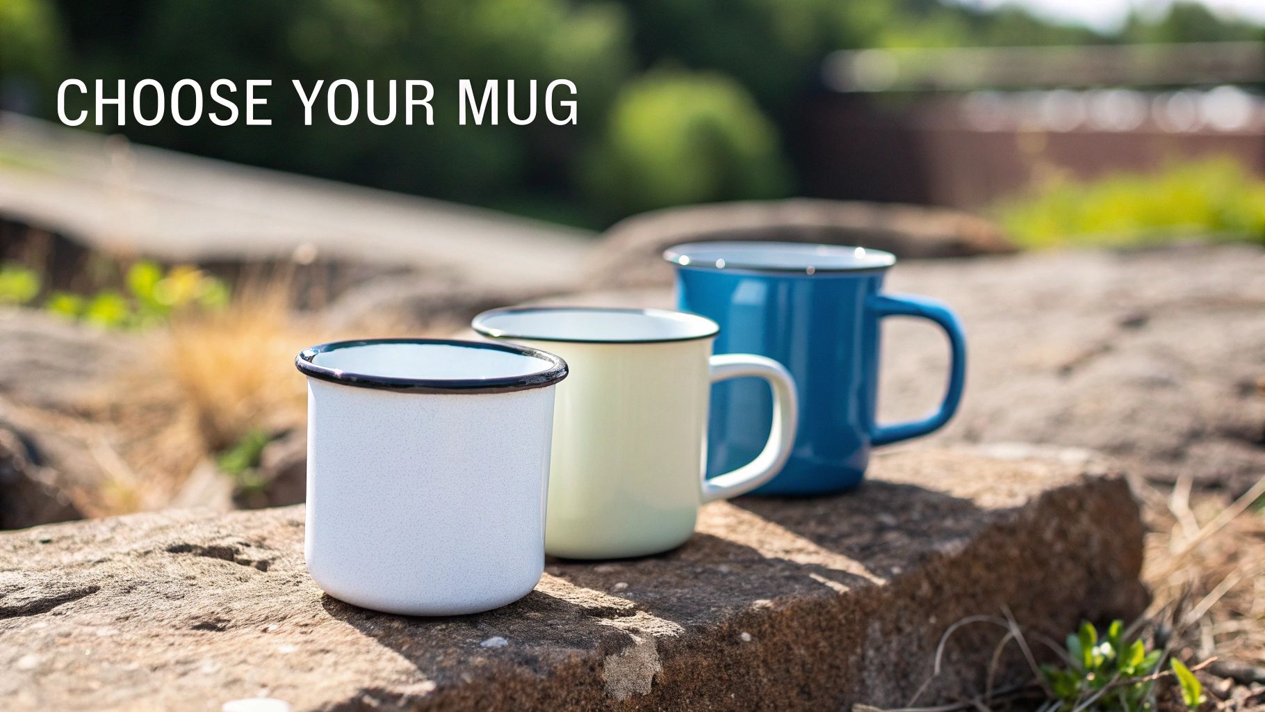 Three colorful enamel mugs, including white, green, and blue, resting on a stone wall outdoors.