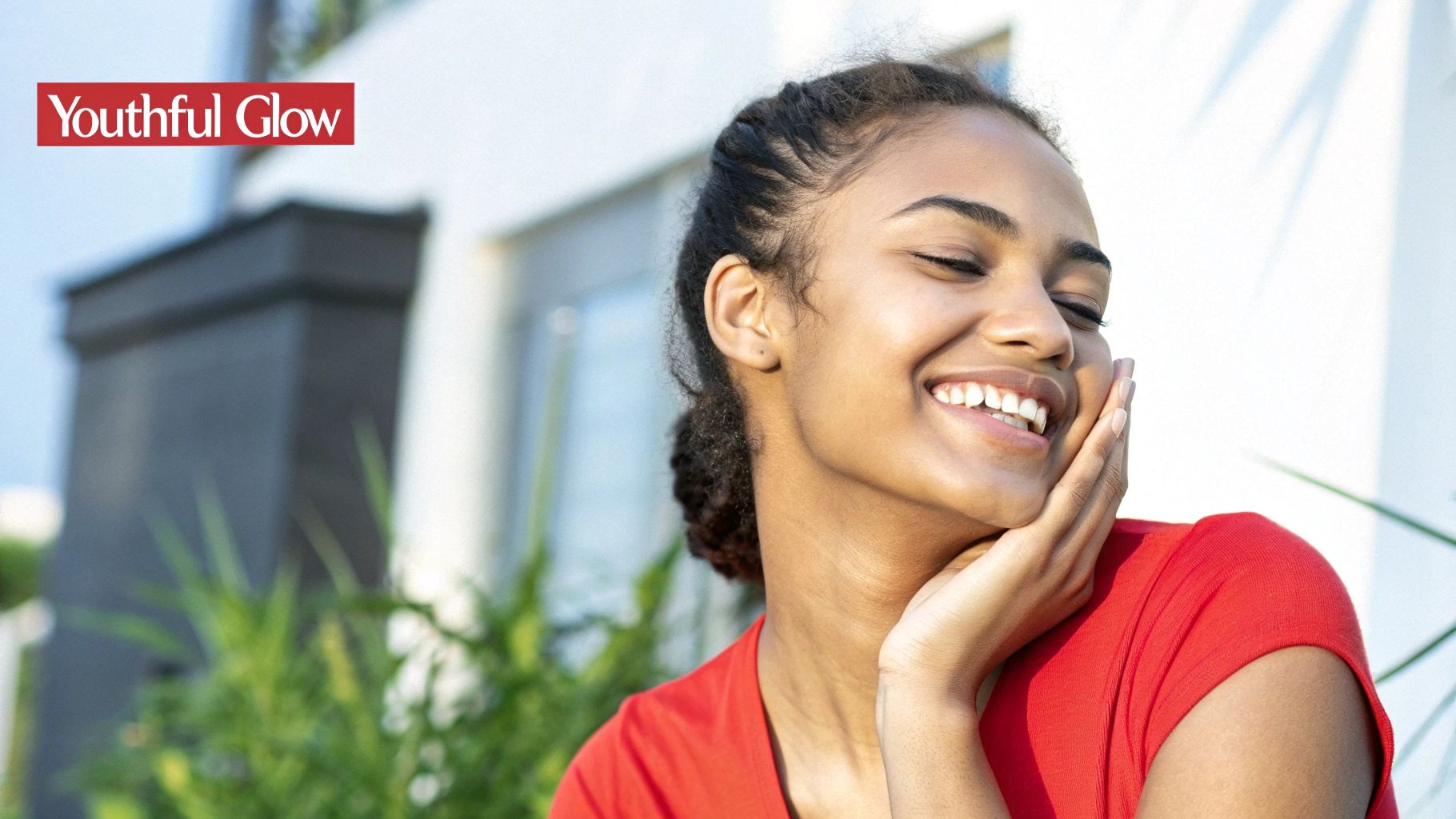 A person's hand holding a pea-sized amount of white cream on their fingertip