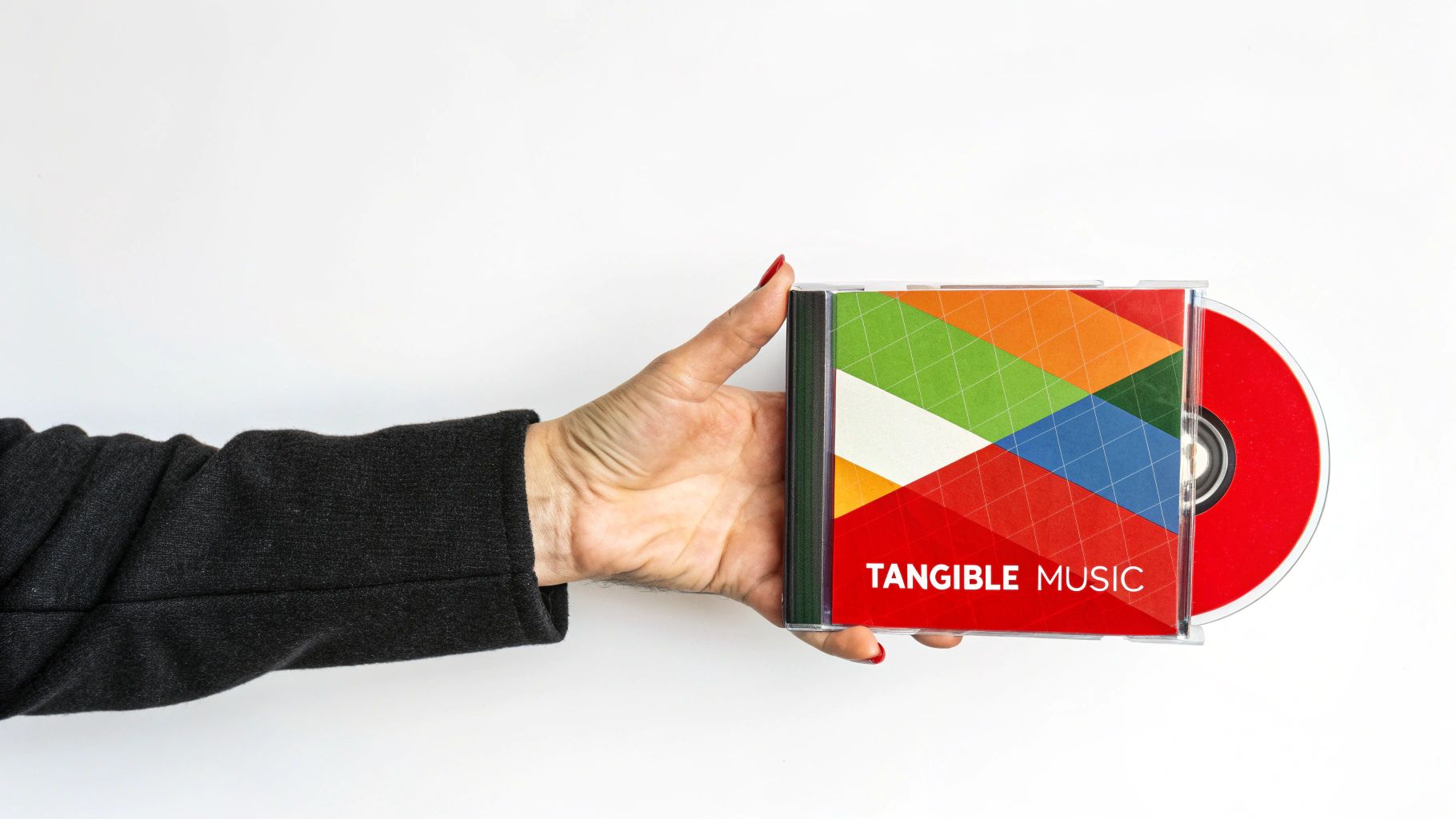 A person holding a custom CD with headphones in the background, representing the personal touch of creating a mixtape.