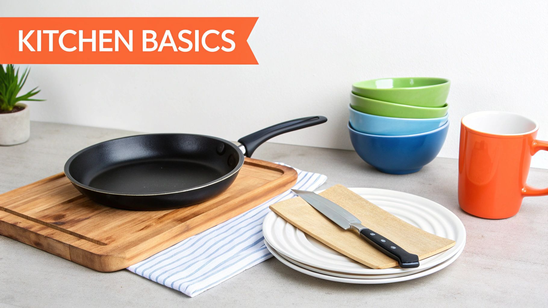 A collection of essential kitchen items including a frying pan, cutting board, colorful bowls, and mug.