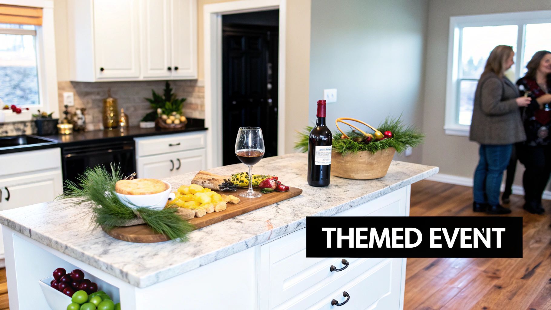 Festive kitchen counter with wine, snacks, and holiday decor, with people conversing.