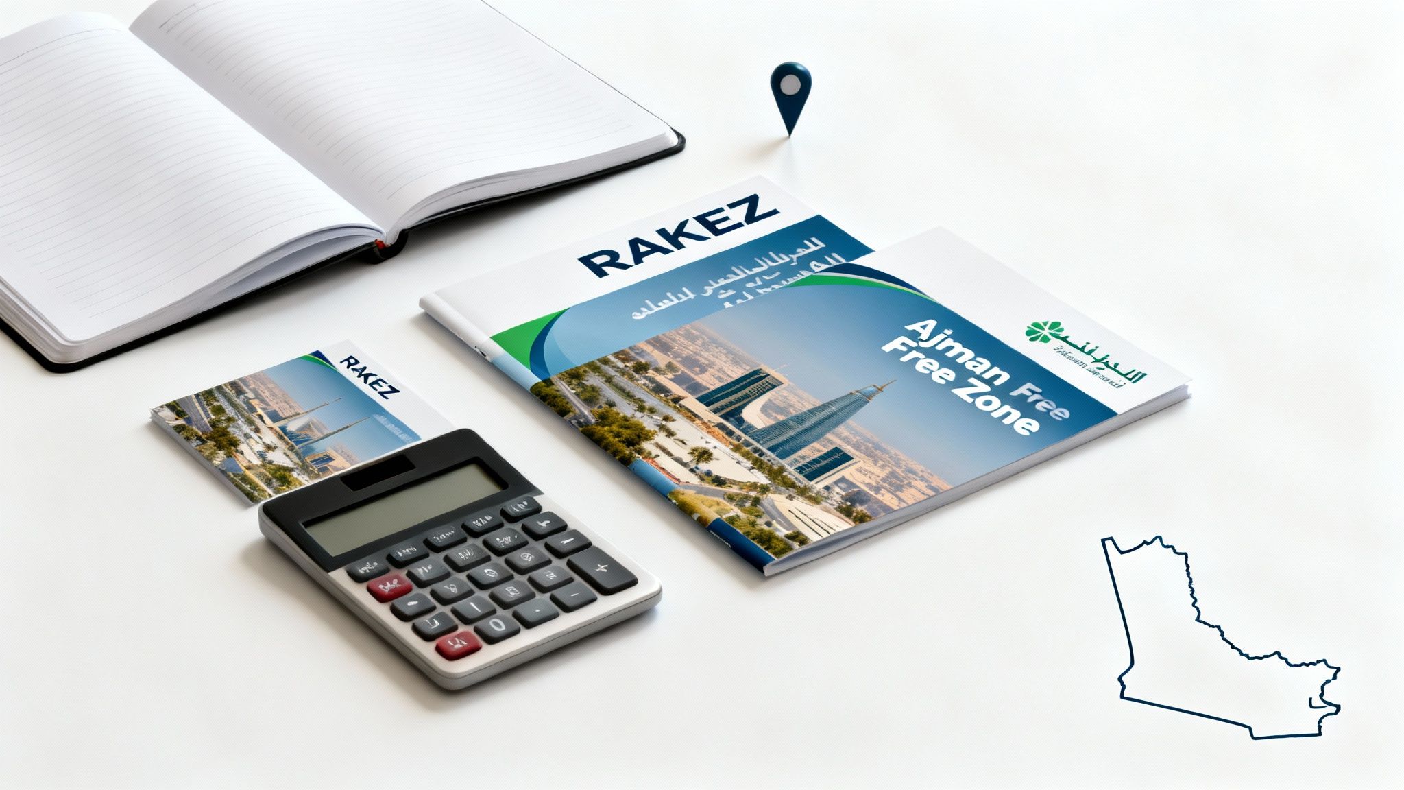 White desk with marketing materials for RAKEZ and Ajman Free Zone, a calculator, and notebook.