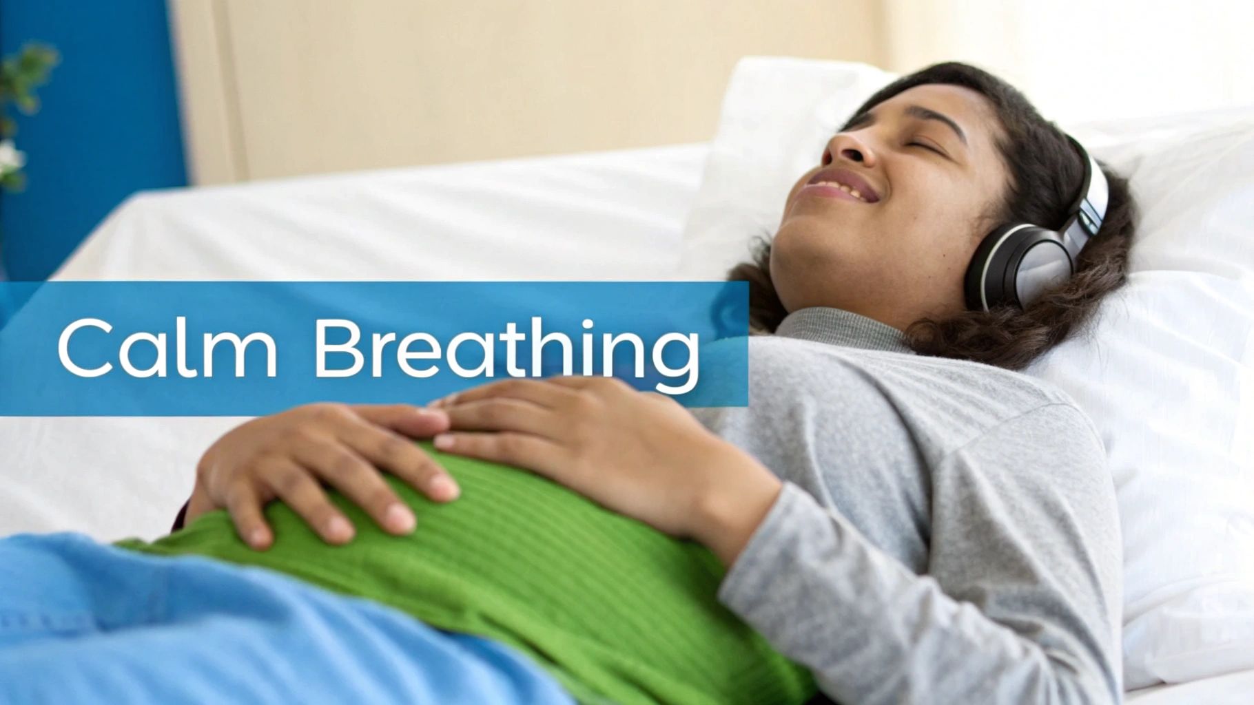 A person with headphones lies peacefully, hands on belly, practicing calm breathing.