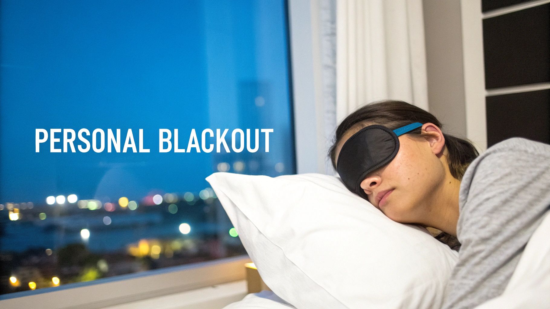 A person sleeps peacefully in bed wearing a black eye mask, with blurred city lights visible outside the window.